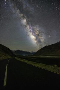 Stunning starry night view of the Milky Way over a road in Zanskar.
